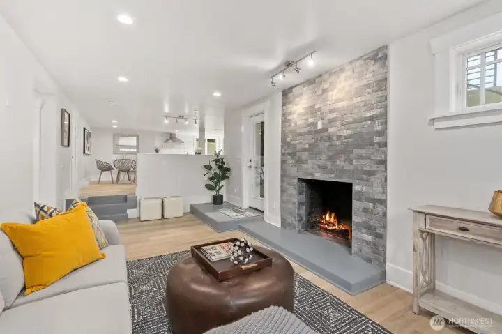 ADU - Living Room.  Cozy wood-burning fireplace and designer tiles.
