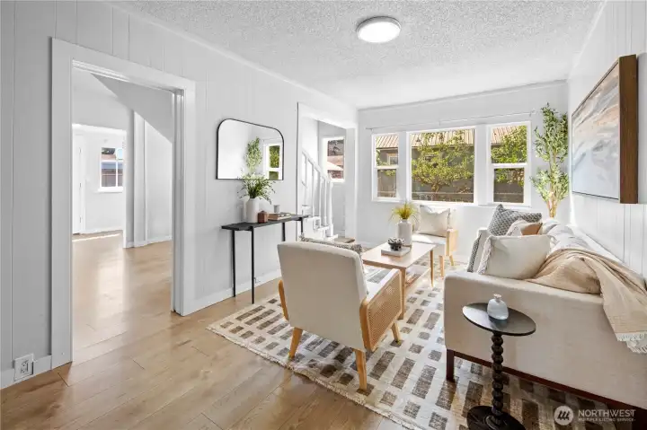 Living room leads to the kitchen and dining area