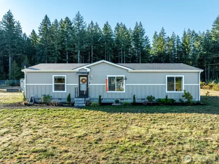 This beautifully maintained 1,492 sq ft, 3 bed / 2 bath home offers welcoming curb appeal and sits on a spacious 1.44-acre lot, blending modern style with rural tranquility.