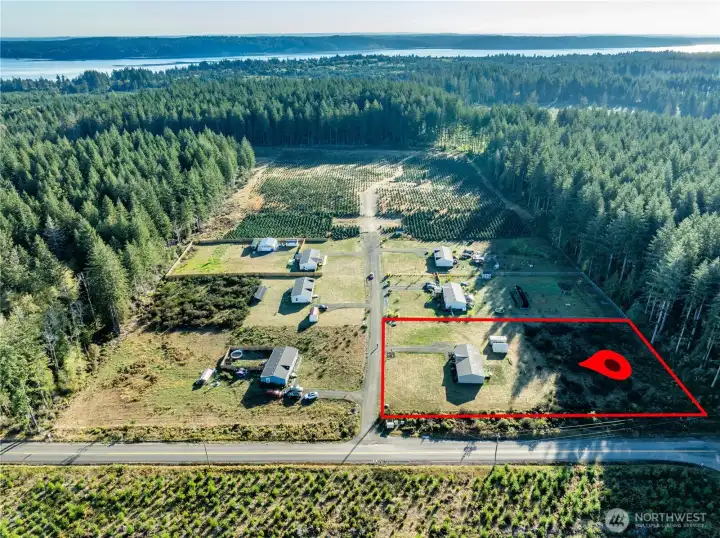 Spacious lot with plenty of open yard and easy access from a quiet rural road.