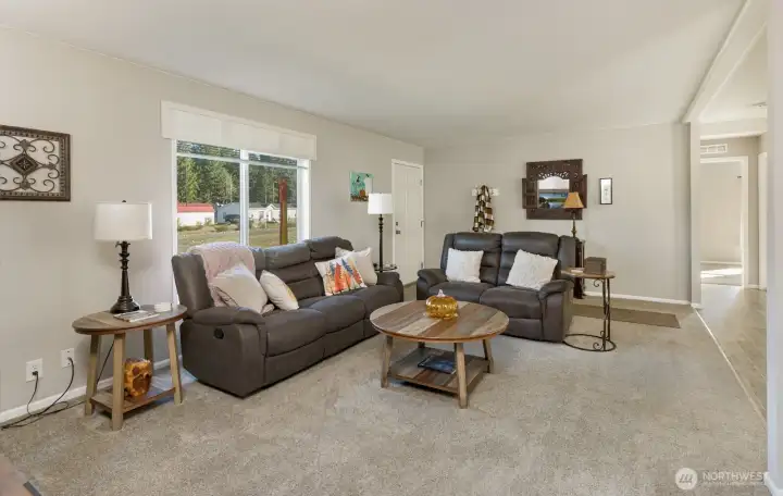 The living room anchors the home with its open feel, cozy atmosphere, and direct connection to the kitchen and dining area.