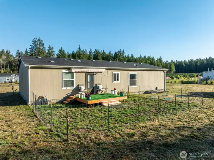 Featuring a cozy deck with an awning, perfect for morning coffee or evening relaxation.