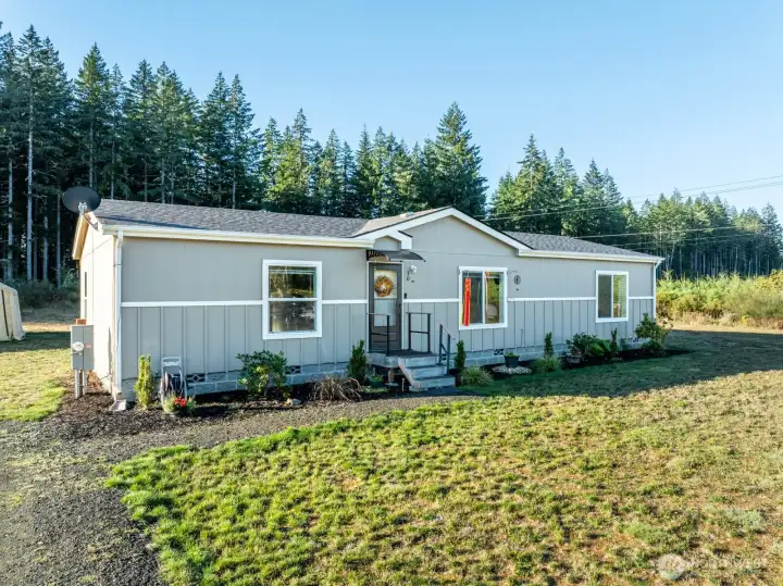 The clean lines and fresh landscaping of this 3 bed, 2 bath home make a lasting first impression, with 1,492 sq ft of living space set against the backdrop of 1.44 private acres.