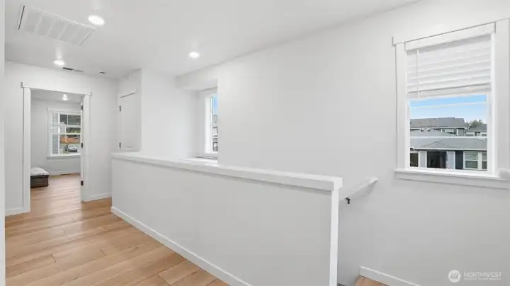 Light-filled transition space leading to bedrooms and the flexible upstairs living area.