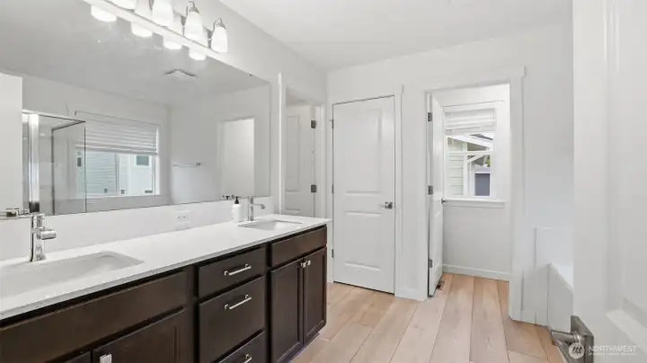 Spacious primary ensuite featuring a dual-sink vanity and plenty of counter space.