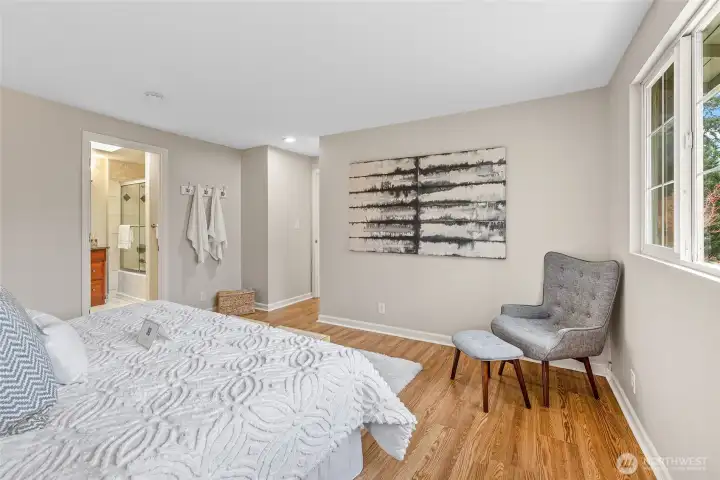 Primary bedroom with adjacent bath.