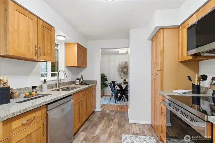 This new kitchen is ready for the home chef! All new cupboards and quartz countertops, new dishwasher, stove, and microwave.