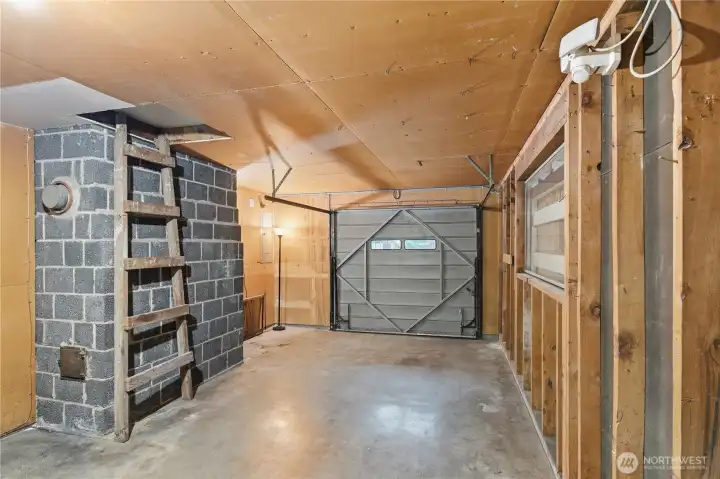This is the original garage of the home, clean and ready for your bins, shelves, and workshop.