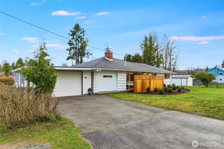 The level, paved driveway provides parking in front of the home.