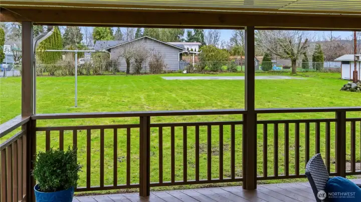Enjoy a view of a backyard soccer game from the covered deck! Or imagine your garden space coming to life.