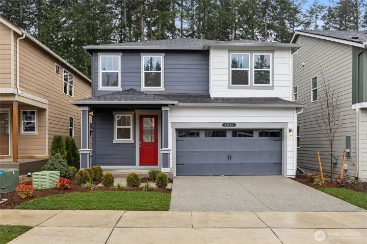 Picture of a similar home at another community. Colors, features, and actual elevation will vary.