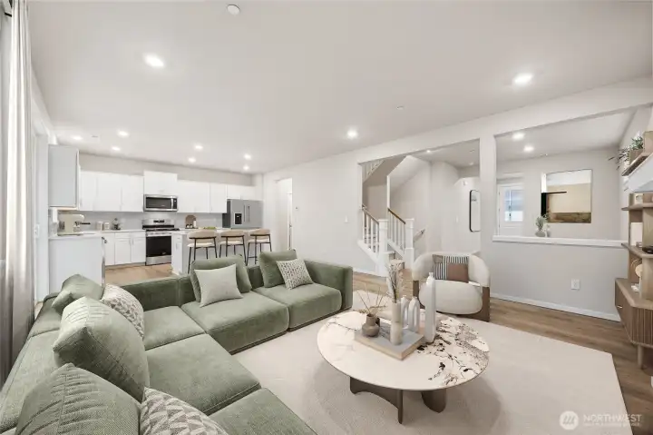 Family room is open to the island kitchen and the stairs to the fully finished basement. Picture for representational purposes only, colors and features may vary.