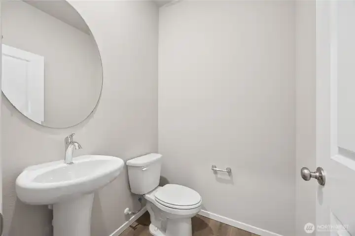 Main floor powder bathroom. Picture for representational purposes only, colors and features may vary.