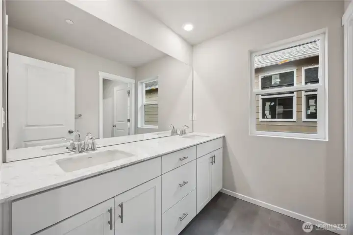 Upstairs hall bath with dual vanities and separate wet area. Picture for representational purposes only, colors and features may vary.