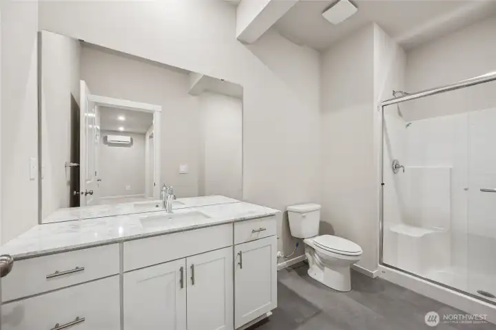 Lower level bathroom with shower. Picture for representational purposes only, colors and features may vary.