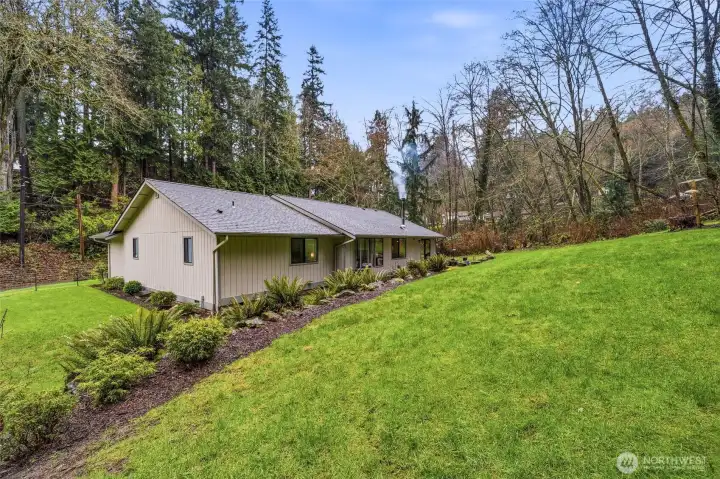 Back of home with spacious yard, highlighting the property’s rare Edmonds land value and usable outdoor space.