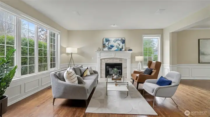 Large windows bring in copious amount of light in this refined formal living room.