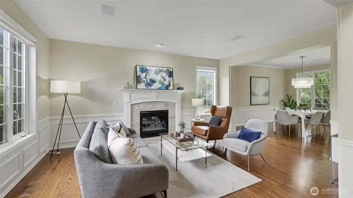 Marble surround of the gas fireplace lends ambiance to the formal living and dining room.