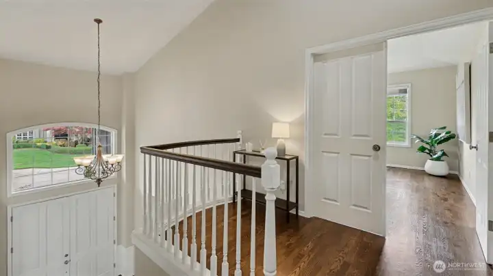 The front stair case leads to a cozy landing and the spacious primary suite.