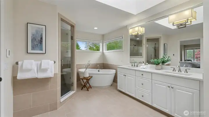 Everyday is a spa day in this remodeled bath with heated tile floors and a custom tile shower.