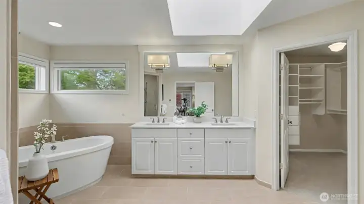 Dual vanity, skylight, and access to a large walk-in closet finish off the well-appointed ensuite.