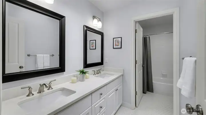 Updated hall bath with dual sinks. Tub and shower have been newly resurfaced.