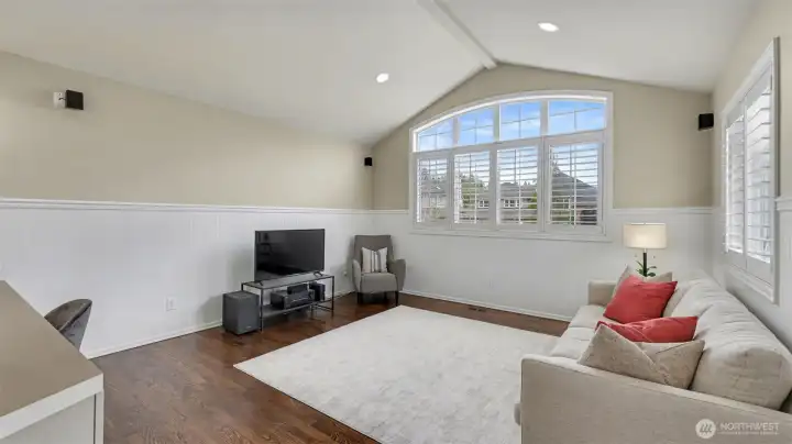 Surround sound in this bonus area with architectural windows and vaulted ceilings.