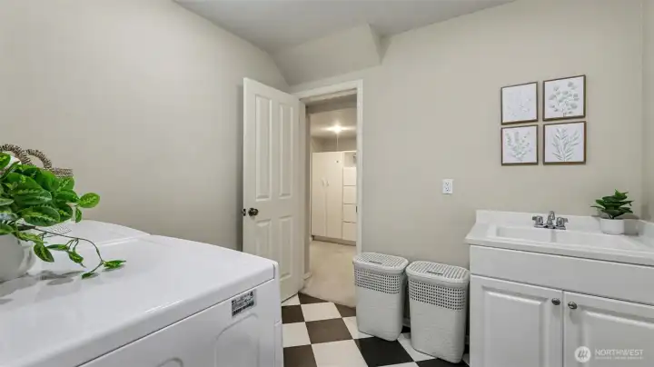 Extra storage space with cabinets off the utility room.