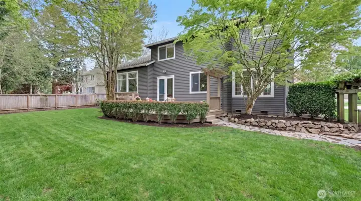 Level backyard and spacious yard, fully fenced. Yard has been reseeded and irrigated- photo is digitally enhanced.
