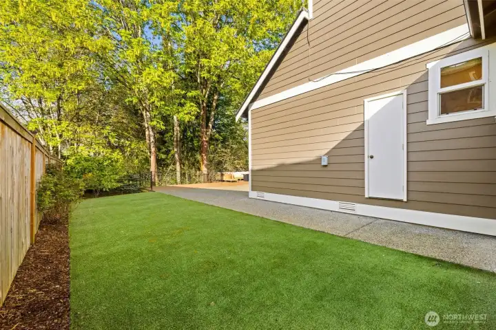 Turfed for easy maintenance. Storage area on the side of the home.