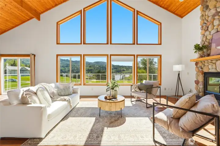 Walls of windows flood the room with natural light.
