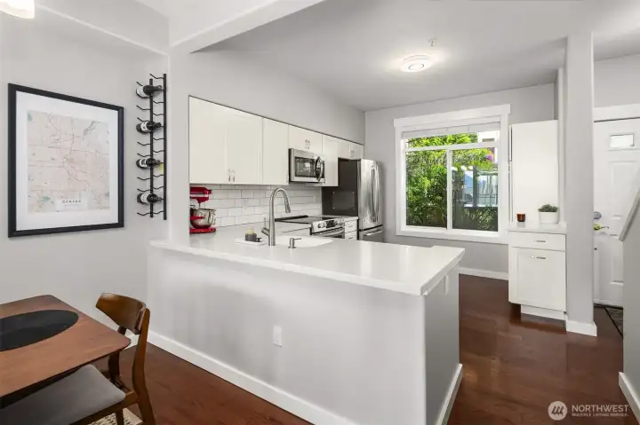 Kitchen with seamless flow to dining.