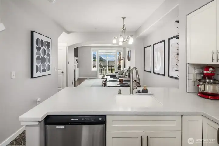 Clear view across kitchen into dining.