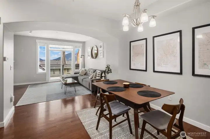 Dining room with seamless flow to living room.