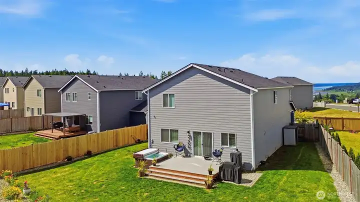 backyard with deck and hot tub