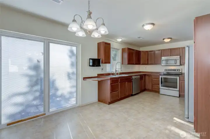 Kitchen / Dinning Rm. Sliding door has in window blinds.