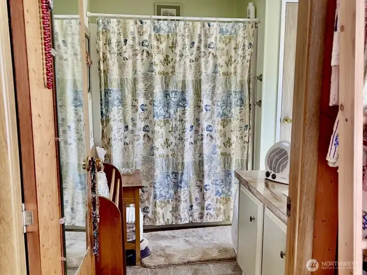 Primary bath with separate toilet area and closet