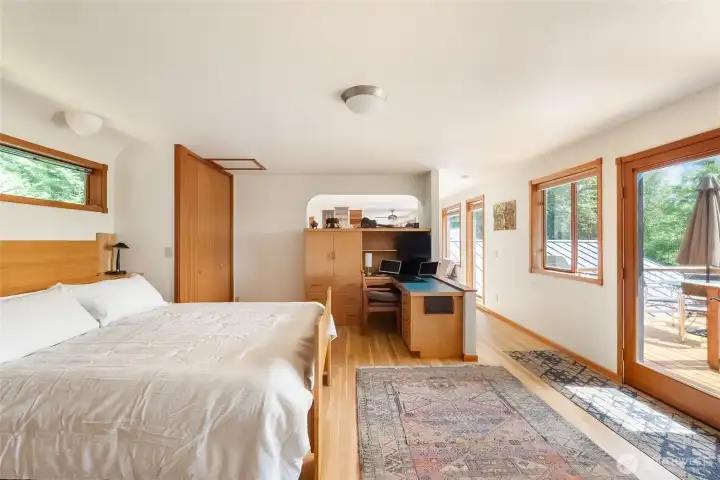 The bedroom is airy and bright with access to the west-facing deck. The bedroom is airy and bright with access to the west-facing deck.