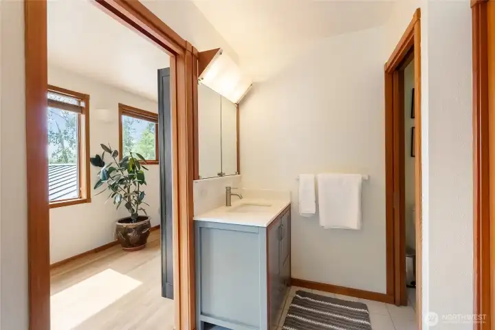 The upper level also features a spacious bathroom with shower and a refinished large tub The upper level also features a spacious bathroom with shower and a refinished large tub