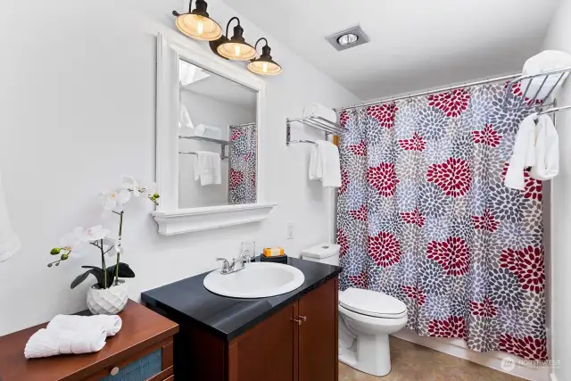 Good sized bathroom with natural light from the skylight.