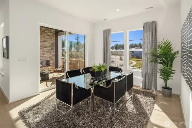 Light-filled dining area that opens to covered deck.