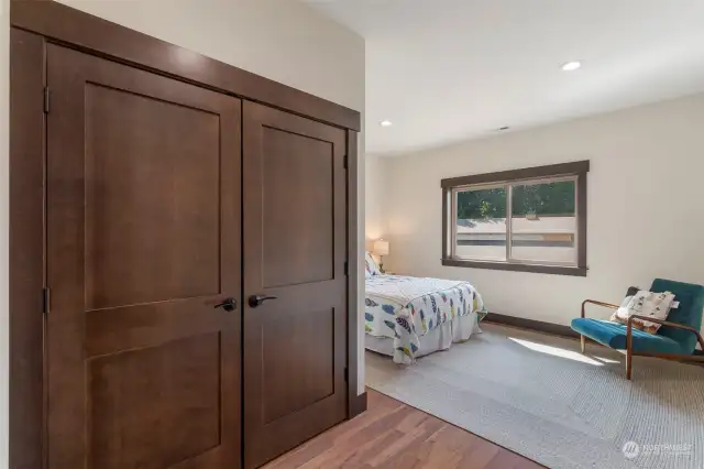 #1 Bedroom with high ceilings, picture windows and luxury closet.