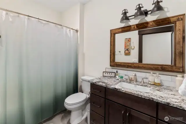 Main bath with tub and shower.