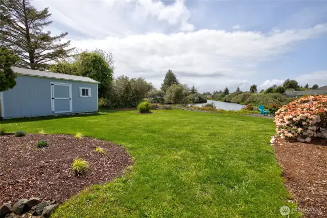 Coming around the side of the home, you enter into the emerald back yard, kept healthy by the sprinkler system!