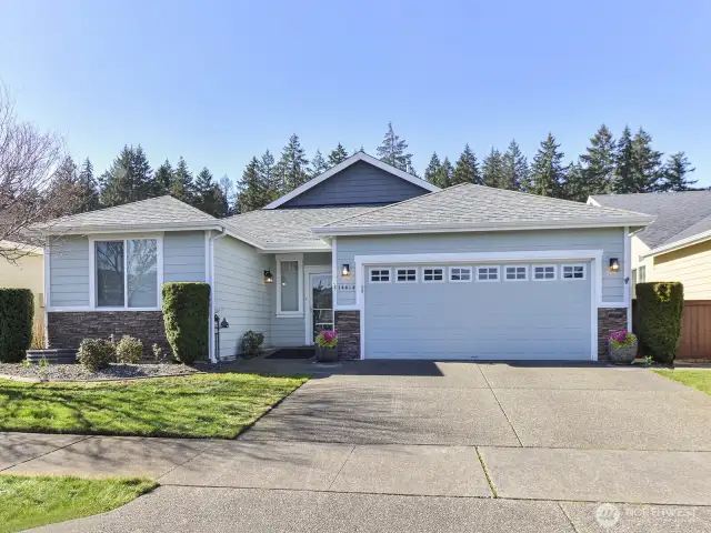 Wide driveway. Remotes for garage door/ Covered front porch. Cement paved gardens. HOA covers the yard mowing.
