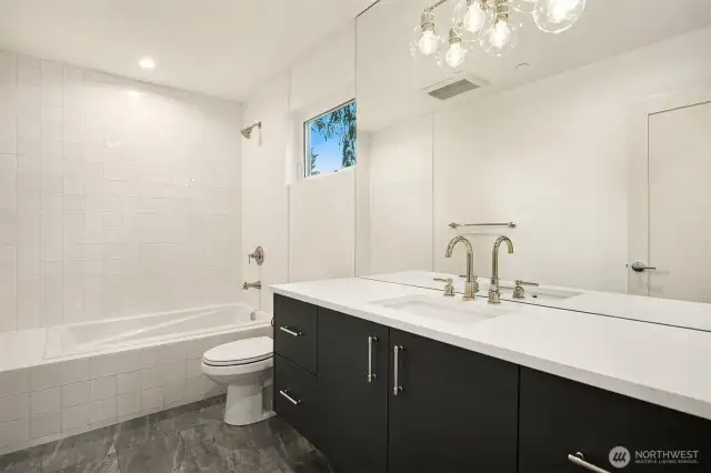 Guest Bathroom with Drop-in Tub, Tile Surround and Floating Vanity