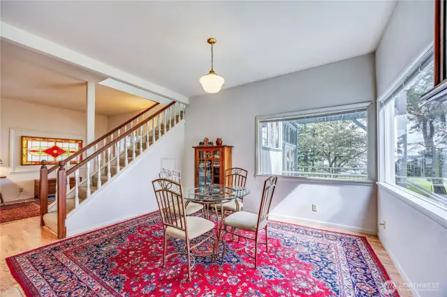 Notice the dining room views across the meadow to Port Townsend.