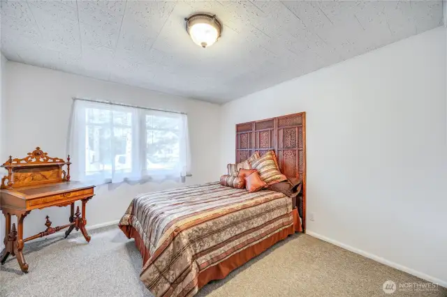 Main floor bedroom located just off the kitchen