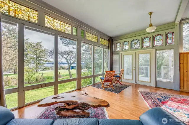 View from the sunroom across the meadow to the Port Townsend Bay.