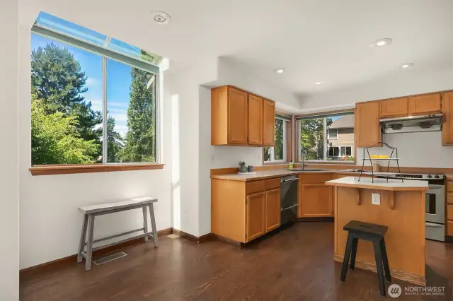 Dining area in kitchen with skylight window